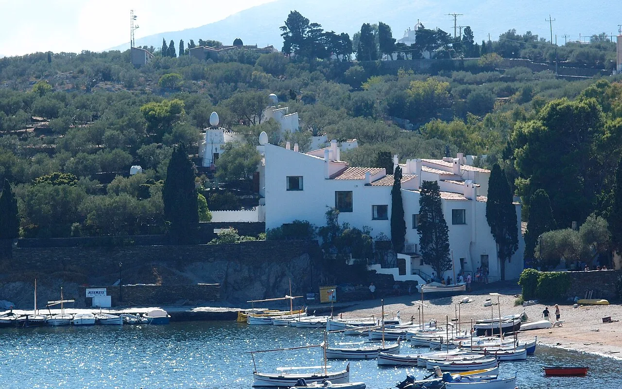 Dalí's house at Portlligat behind a harbour of small white fishing boats