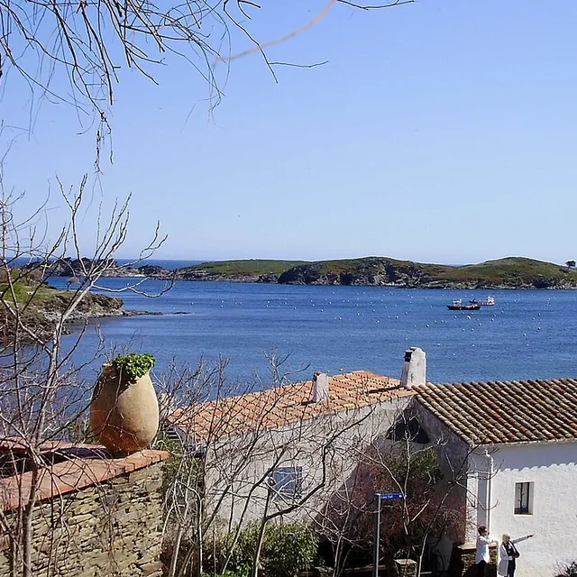 The last stretch of the walk to Portlligat, a white house and terracotta roofs above the bay